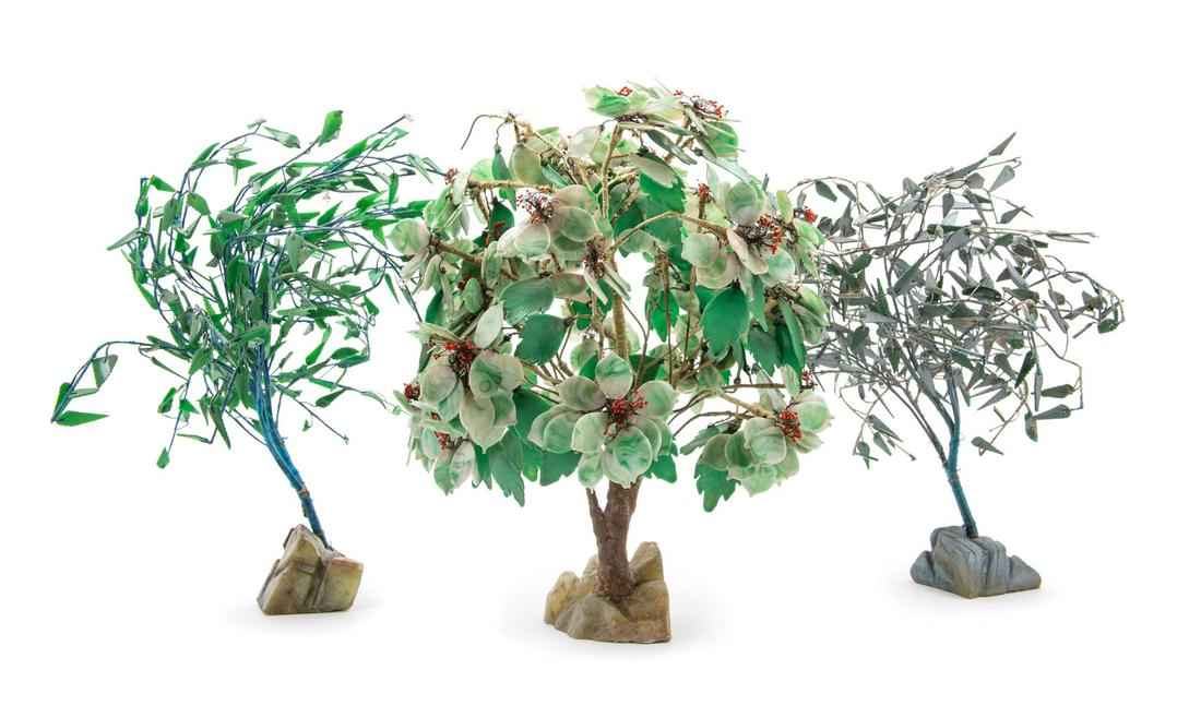 Three Chinese Hardstone Plants Tallest: height 19 in.,: Three Chinese Hardstone Plants 20TH CENTURY each comprised of hardstone foliage emitting from a spray of branches rooted to a rough stone. Tallest: height 19 in., 48 cm. Property from a Private Coll