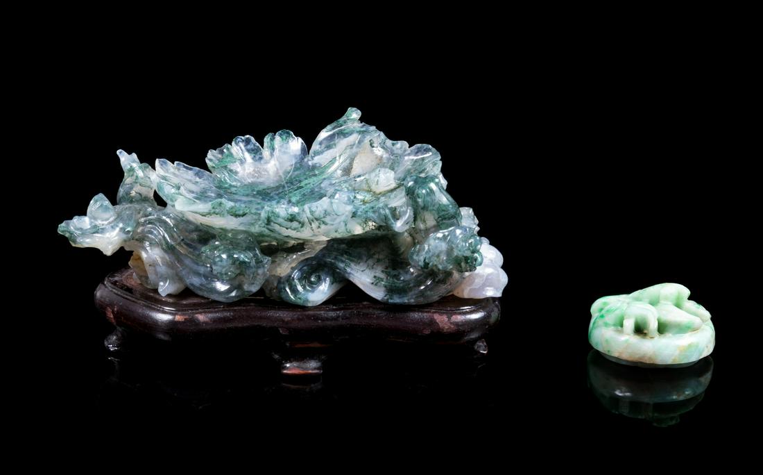A Chinese Green Quartz Lotus-Form Brush Washer Length: A Chinese Green Quartz Lotus-Form Brush Washer 20TH CENTURY together with a jadeite Cover, the brush washer raised on a fitted hardwood stand. Length 4 1/2 in., 11 cm. Property from the Collection o