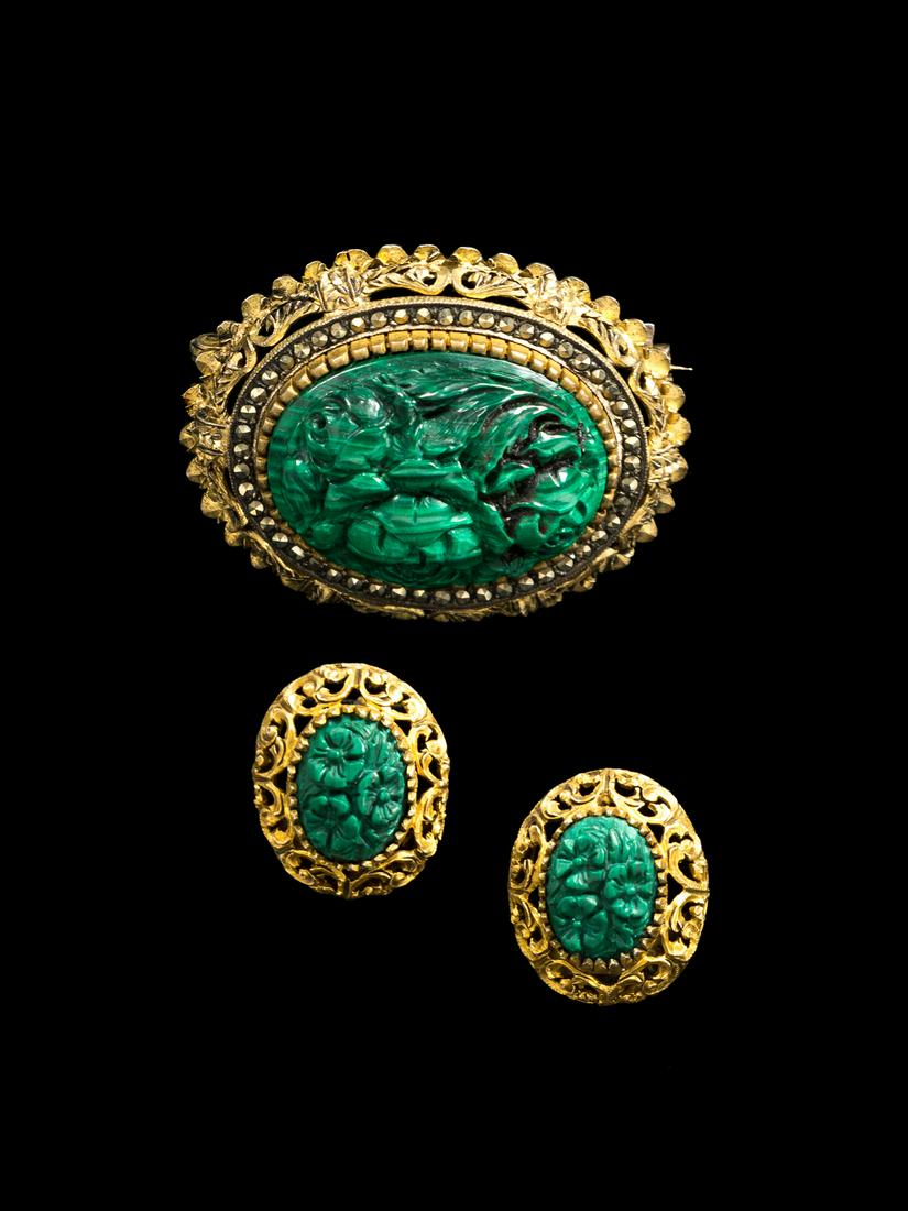 A Chinese Malachite Brooch and a Pair of Earclips: A Chinese Malachite Brooch and a Pair of Earclips 20TH CENTURY each carved with floral decoration. Brooch: length 1 1/2 in., 3.8 cm.