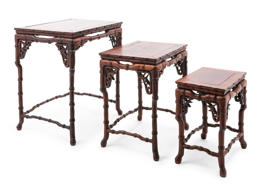 A Set of Three Chinsee 'Imitation Bamboo' Rosewood: A Set of Three Chinsee 'Imitation Bamboo' Rosewood Stands 19TH CENTURY each with a rectangular top with a molded bamboo form double cushion edge, atop four sectioned legs supported with foliate- car