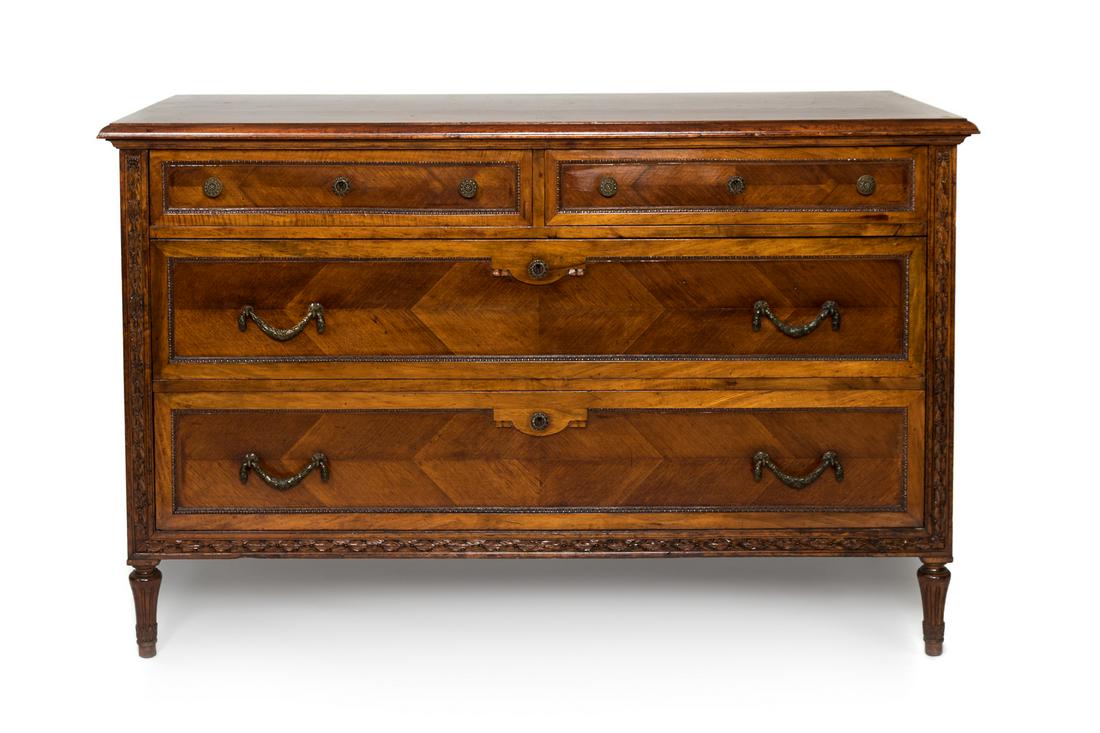 A Louis XVI Style Carved Fruitwood Commode Height 35 x: A Louis XVI Style Carved Fruitwood Commode 20TH CENTURY Height 35 x width 54 1/2 x depth 24 inches.