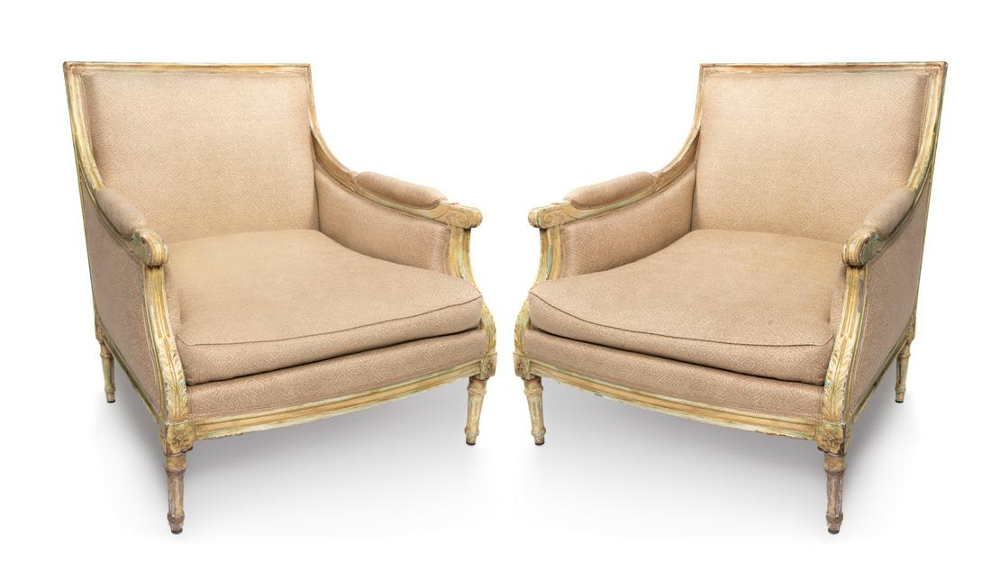 A Pair of Louis XVI Style Carved and Painted Bergeres: A Pair of Louis XVI Style Carved and Painted Bergeres 20TH CENTURY Height 34 1/4 inches.