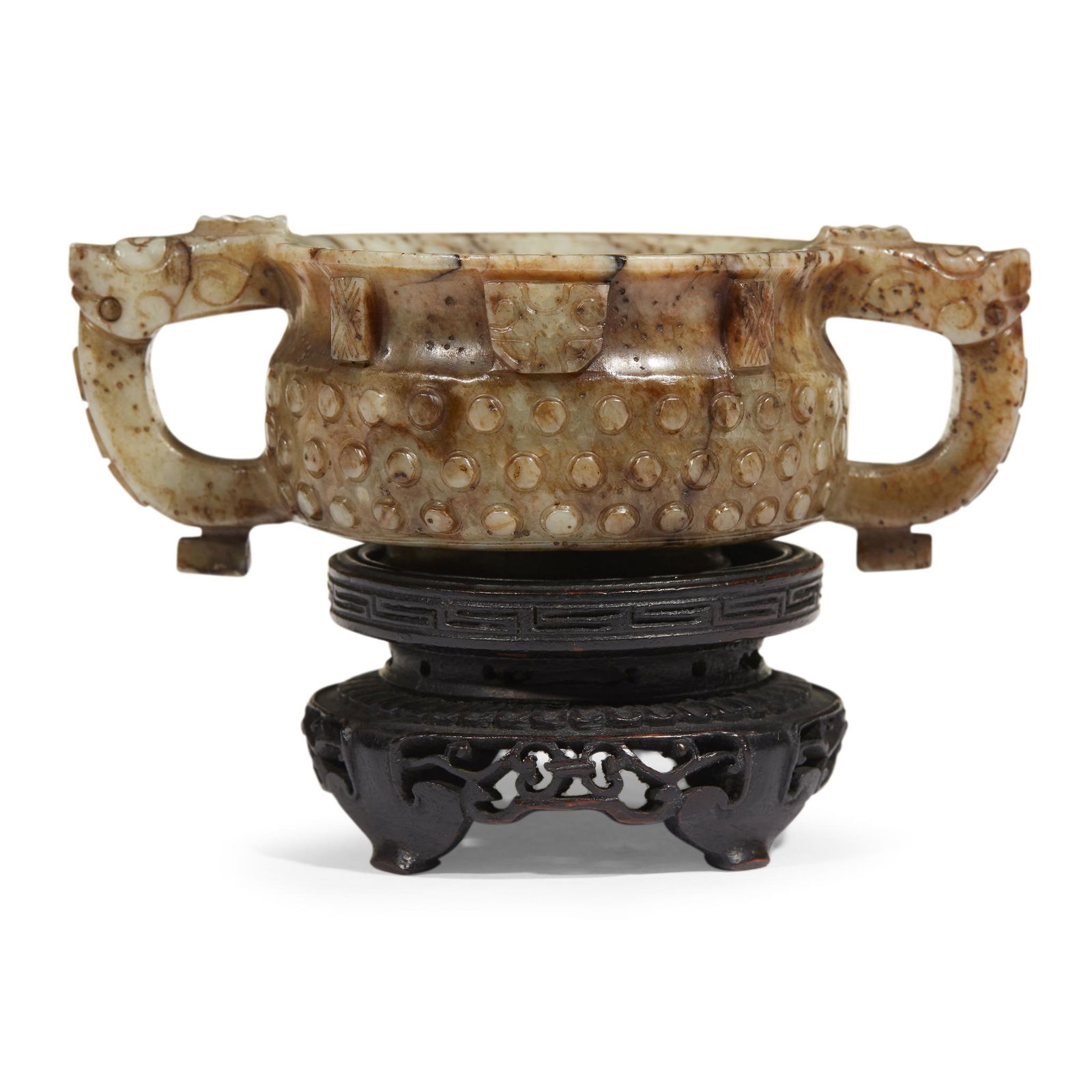 A Chinese archaistic gui-form grey and brown jade (1 of 4)