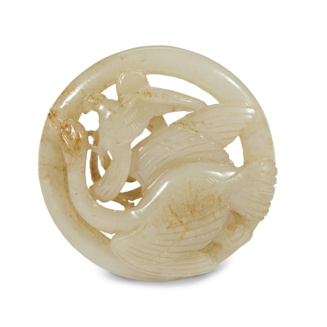 A Chinese carved and pierced greyish white and russet (1 of 2)