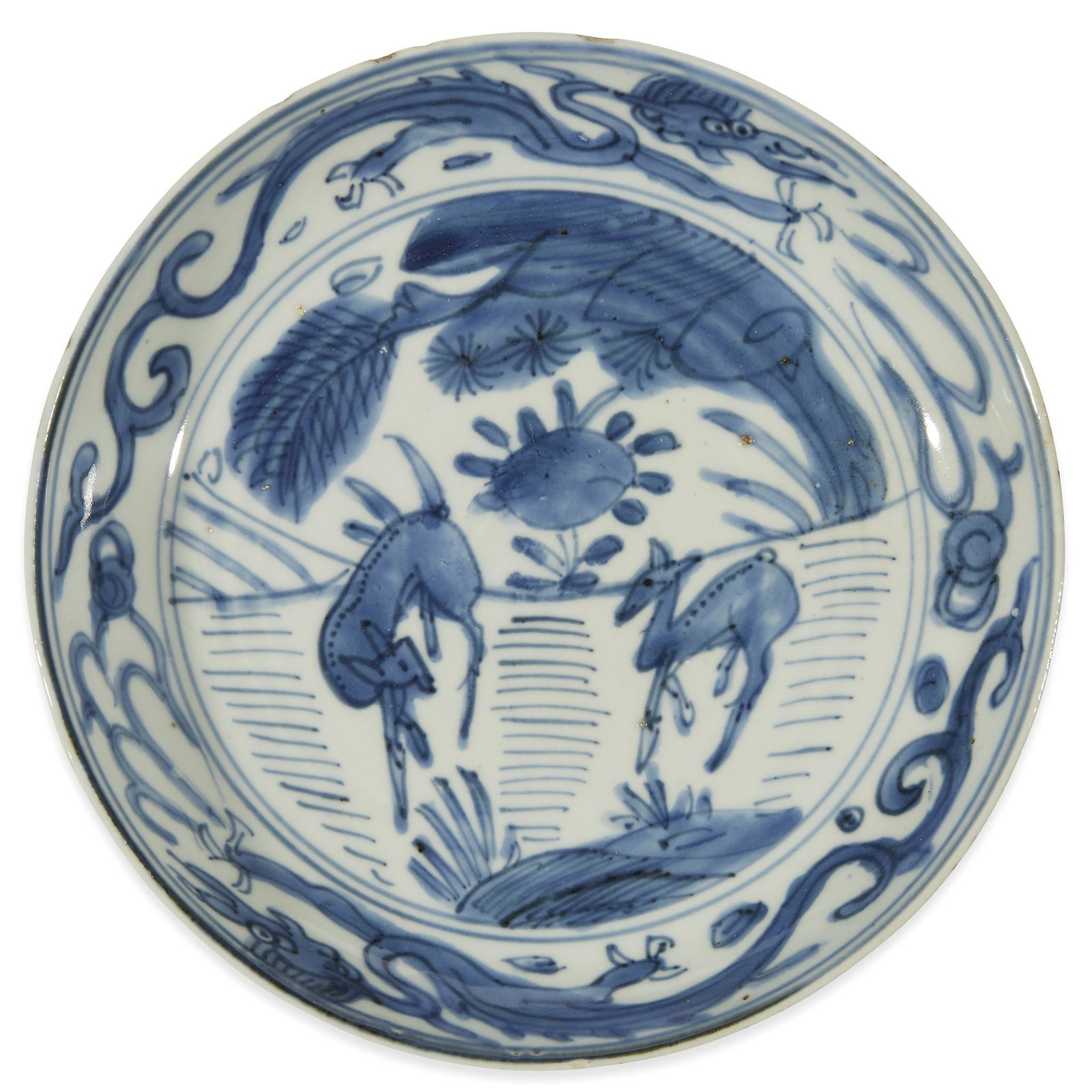 A Chinese blue and white porcelain "Two Deer" dish,: A Chinese blue and white porcelain "Two Deer" dish Ming dynasty, circa 1550-1600. The deer depicted among foliage; the interior rim decorated with a dragon border. Dia: 7 3/4 in.