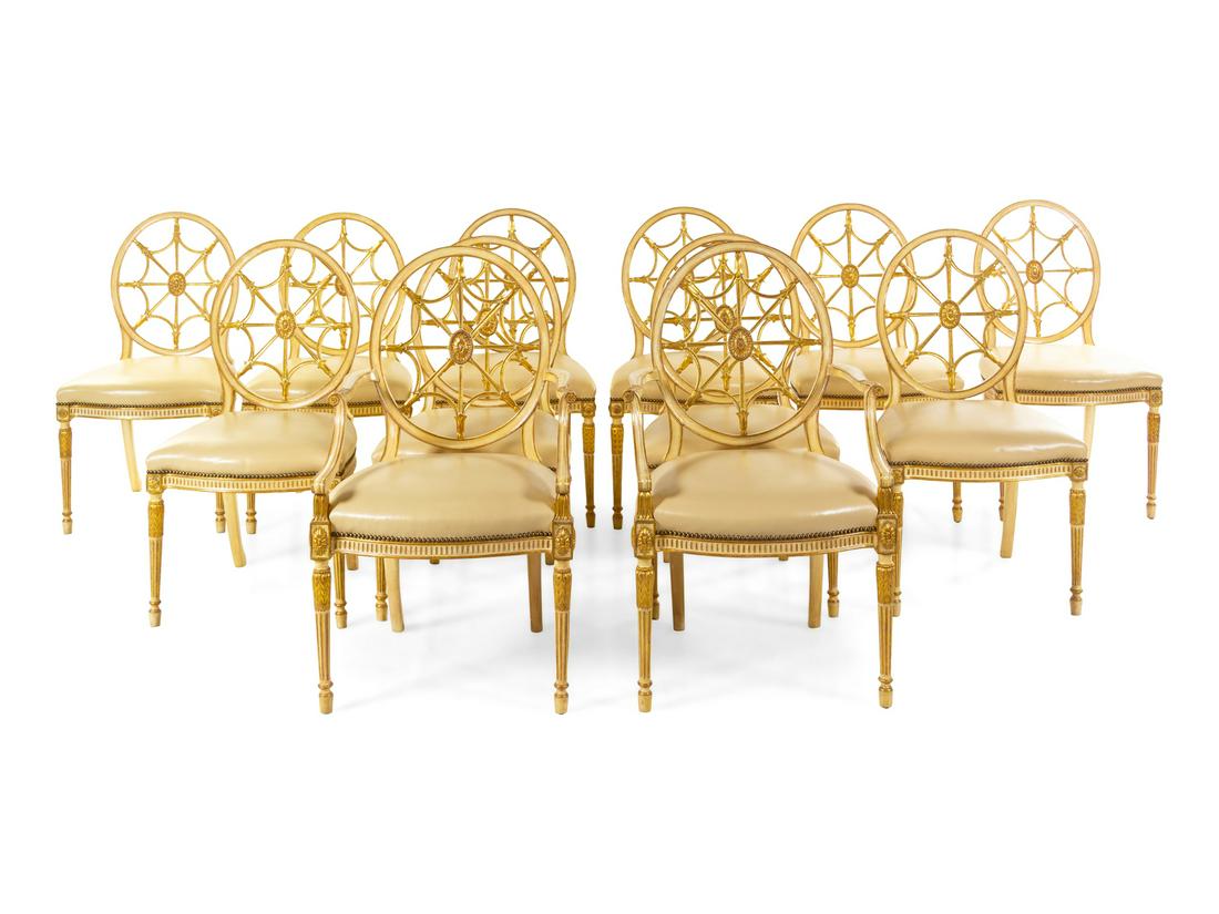 A Set of Twelve George III Style Cream-Painted and: A Set of Twelve George III Style Cream-Painted and Parcel Gilt Dining Chairs 20th Century comprising two armchairs and ten side chairs. Height 38 3/4 inches. Property from the Collection of Marion and