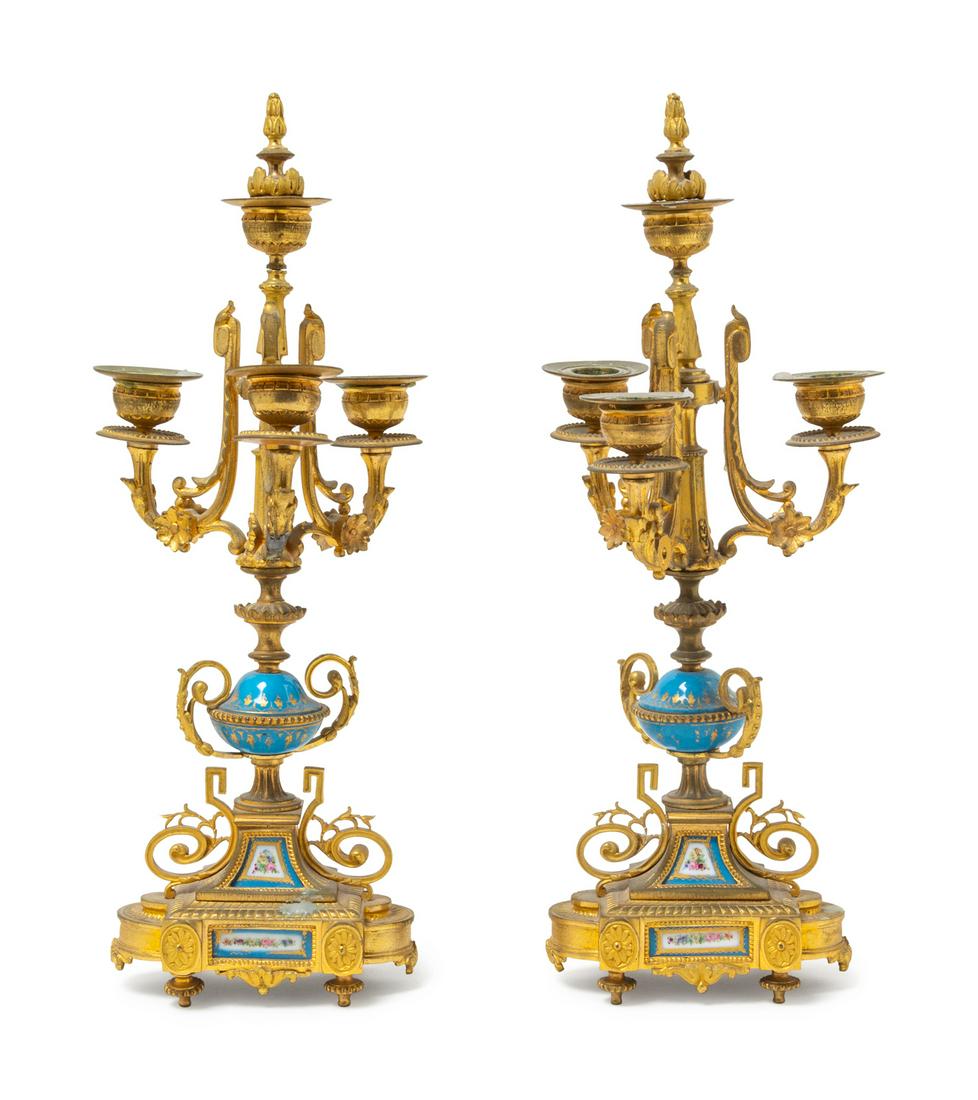 A Pair of Napoleon III Gilt Bronze and Sevres Style: A Pair of Napoleon III Gilt Bronze and Sevres Style Porcelain Three-Light Candelabra Late 19th Century Height 16 inches. Provenance: Property from the Collection of Dr. Gregory Boshart and Dr. Willi