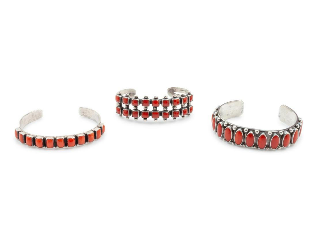 Three Navajo and Southwestern Sterling Silver and Coral: Three Navajo and Southwestern Sterling Silver and Coral Cuff Bracelets THIRD QUARTER 20th CENTURY one by Don Lucas (American, 20th Century), another by Randy Boyd (Navajo, 20th Century) Provenance: Pr