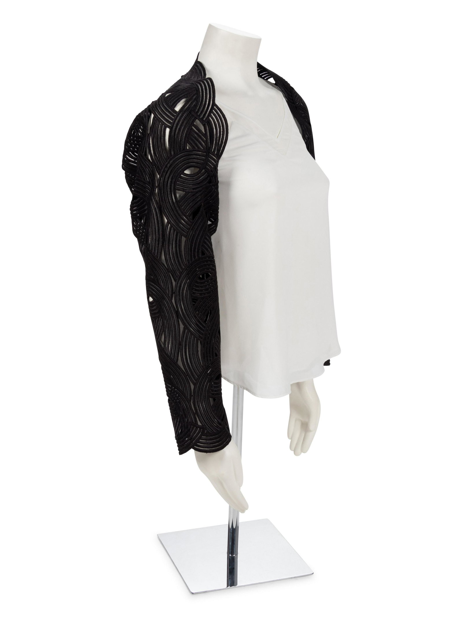 Geoffrey Been Black 'Ribbon' Bolero, 1990s: Geoffrey Been Black 'Ribbon' Bolero, 1990s Bolero made of large black swirls shaped into sleeves and specially cut and pieces together around neckline to form garment. Label: Geoffrey Beene Inventor