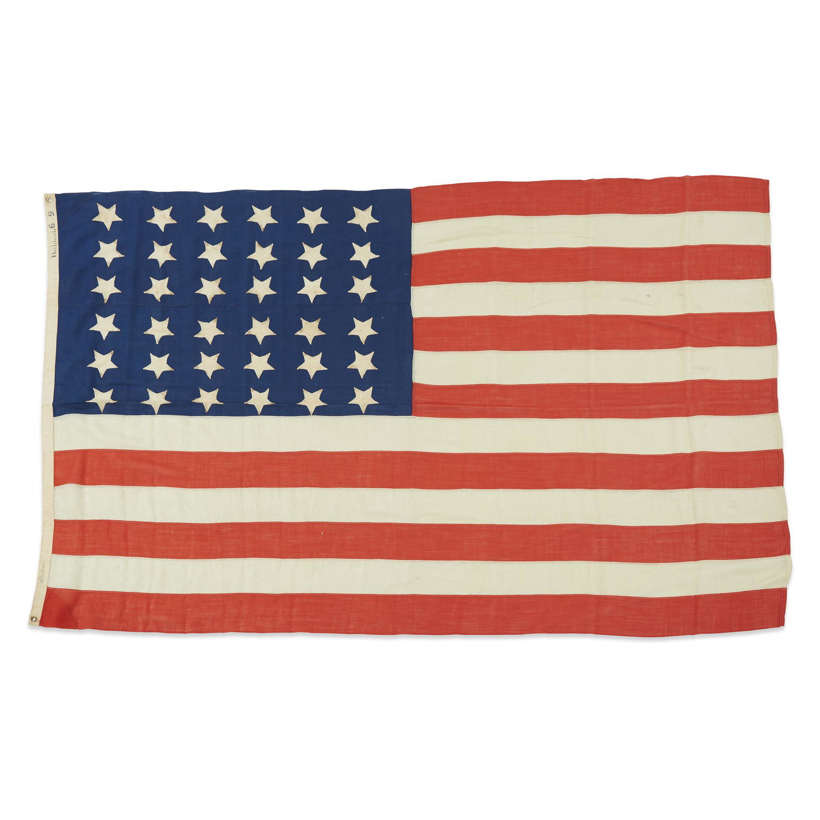 A 36-Star American Flag commemorating Nevada statehood: A 36-Star American Flag commemorating Nevada statehood, 1865-1876 Hand-sewn, single appliqued 'puffy' stars arranged in 6 rows of 6 on a wool bunting canton, machine-sewn wool bunting stripes, canvas 