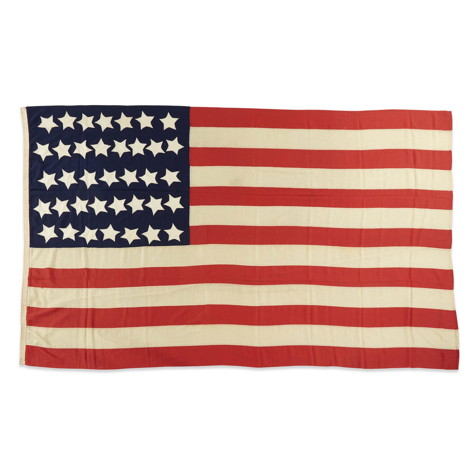 A 37-Star American Flag commemorating Nebraska: A 37-Star American Flag commemorating Nebraska statehood, 1867-1876 Hand-sewn, single appliqued cotton 'Puffy Starfish' stars arranged in rows of 7,8,7,8,7 on a three-part wool bunting canton, hand-se