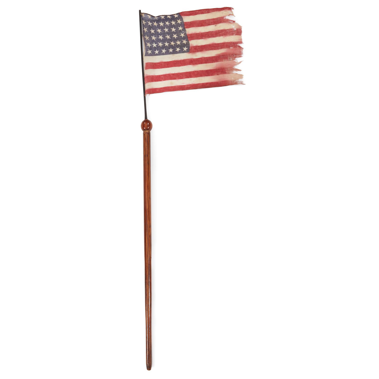 Grain-painted cherrywood Flag cane fitted with a: Grain-painted cherrywood Flag cane fitted with a 38-Star American parade Flag commemorating Nevada statehood, 19th century Printed cotton American Flag on black-painted wood pole. L: 35 1/4 in.