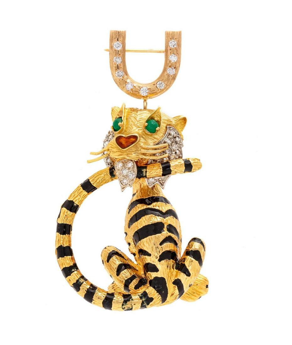 A Yellow Gold, Diamond, Gemstone and Enamel Tiger: A Yellow Gold, Diamond, Gemstone and Enamel Tiger Brooch, containing 41 round brilliant and single cut diamonds weighing approximately 0.55 carat total, with black and orange enamel detail and two rou