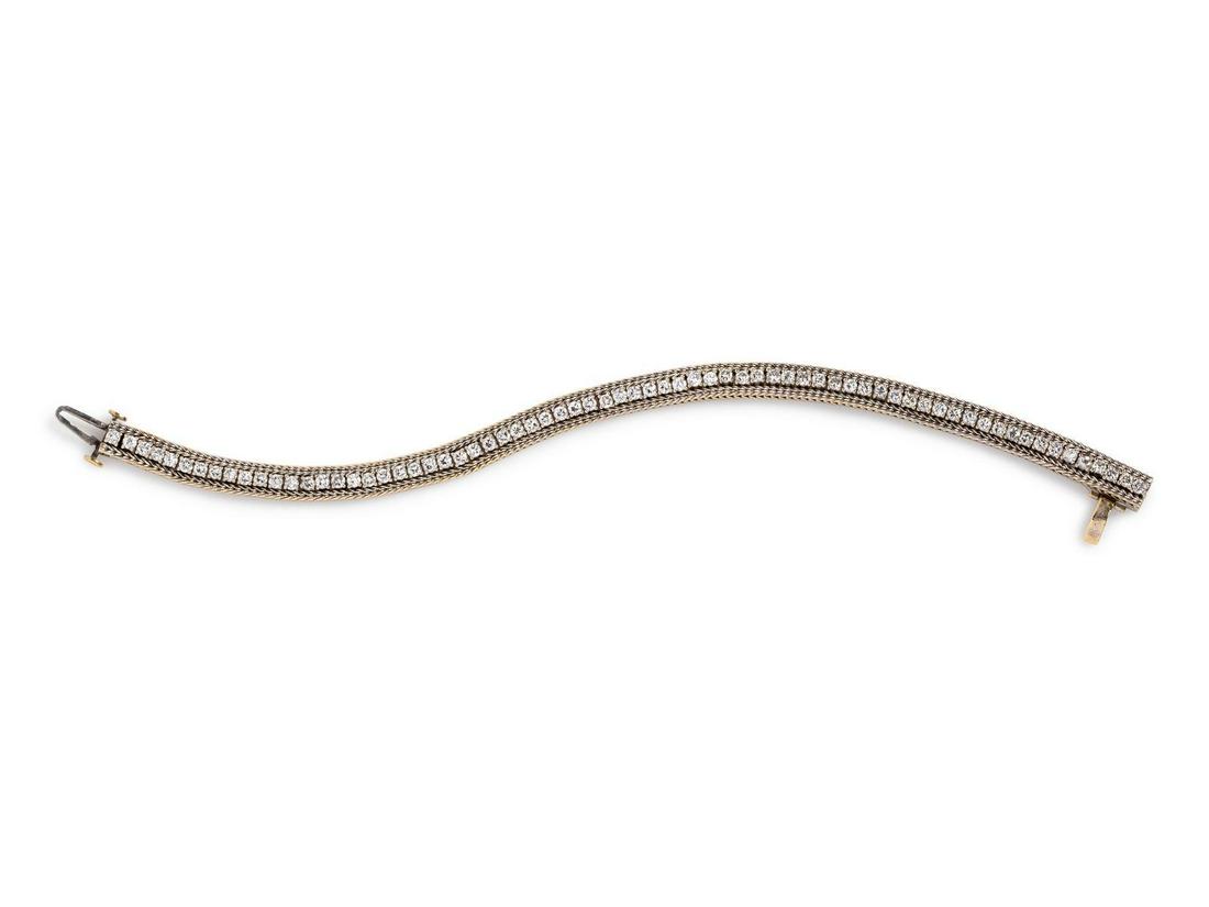 A 14 Karat White Gold and Diamond Bracelet,: A 14 Karat White Gold and Diamond Bracelet, containing 70 round brilliant cut diamonds weighing approximately 3.15 carats total, edged with wheat chain. Stamp: 14K. 12.60 dwts. Provenance: