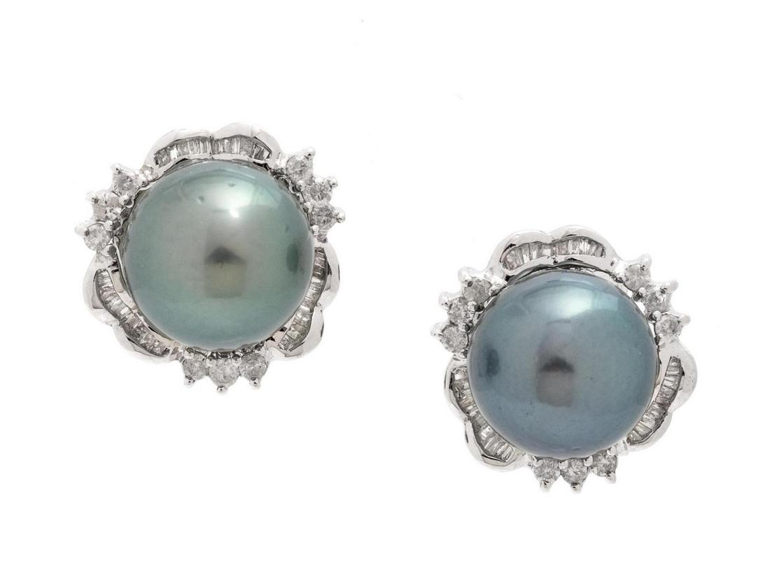 A Pair of 14 Karat White Gold, Cultured Tahitian Pearl: A Pair of 14 Karat White Gold, Cultured Tahitian Pearl and Diamond Earclips, containing two Tahitian pearls measuring approximately 11.30 mm in diameter, 18 round brilliant cut diamonds weighing appro