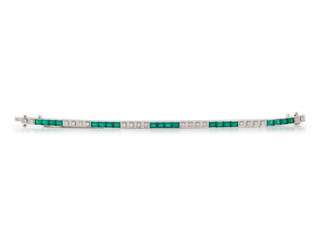 A 14 Karat White Gold, Emerald Simulant and Diamond: A 14 Karat White Gold, Emerald Simulant and Diamond Bracelet, containing 20 rectangular step cut emerald simulants measuring approximately 3.30 x 4.35 mm and 20 round brilliant cut diamonds weighing a