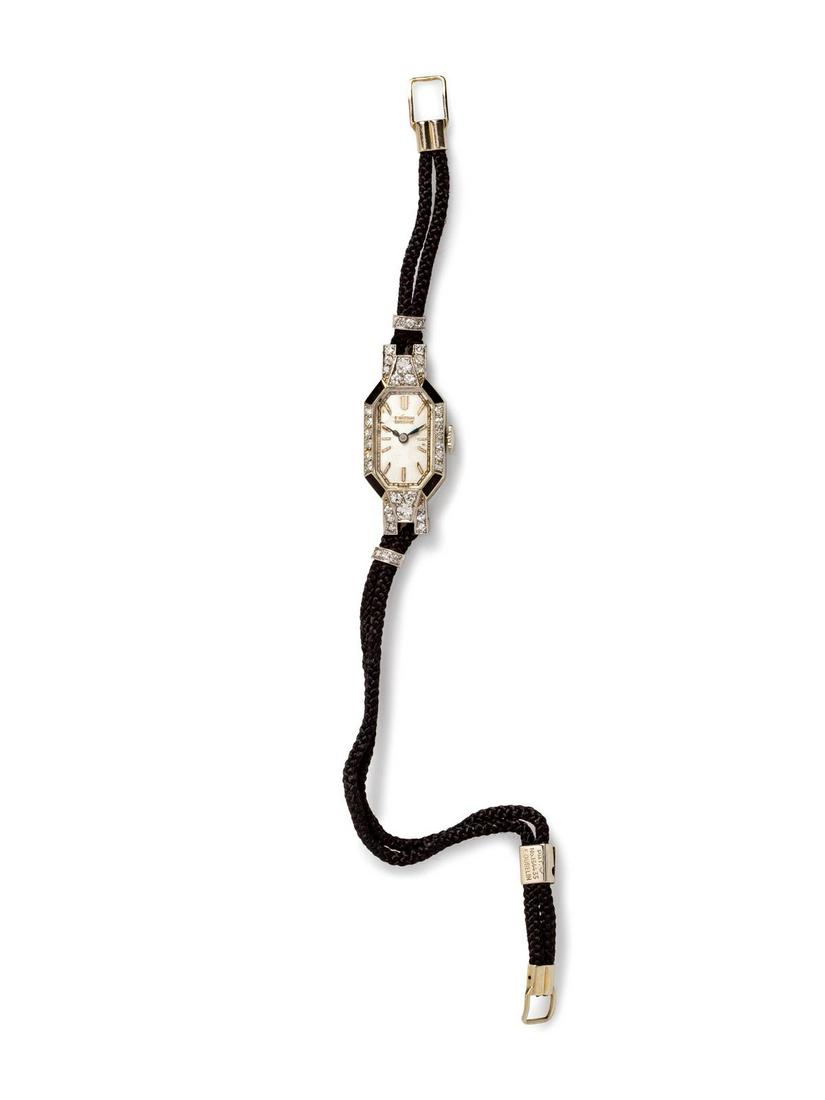 An Art Deco 18 Karat White Gold, Diamond and Enamel: An Art Deco 18 Karat White Gold, Diamond and Enamel Wristwatch, E. Gubelin, the bezel, lugs and bracelet containing 36 old European, transitional and single cut diamonds weighing approximately 0.45 ca
