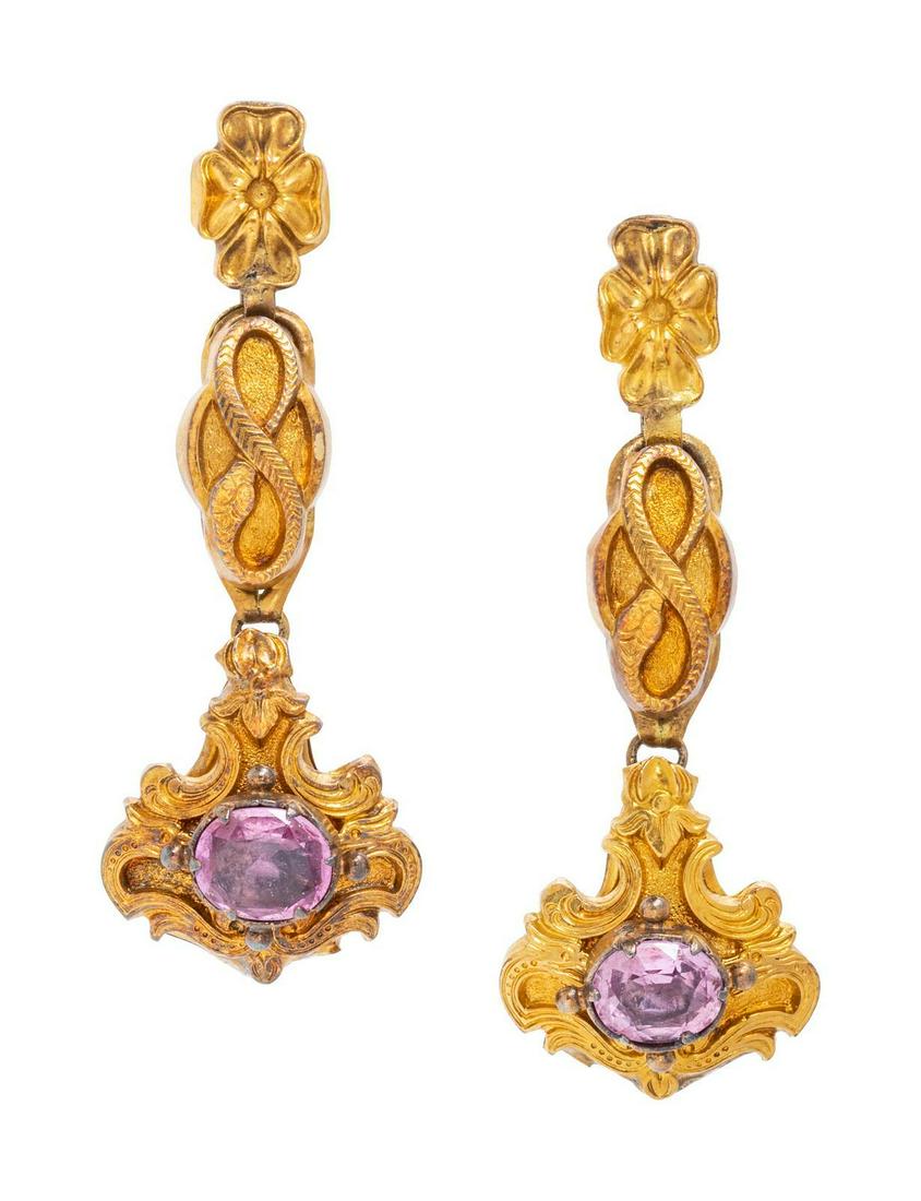 A Pair of Victorian Yellow Gold and Amethyst Screwback: A Pair of Victorian Yellow Gold and Amethyst Screwback Earrings, with flower and snake designs, containing two oval mixed cut amethyst measuring approximately 6.70 x 5.65 mm. 3.85 dwts. Provenance: Pr