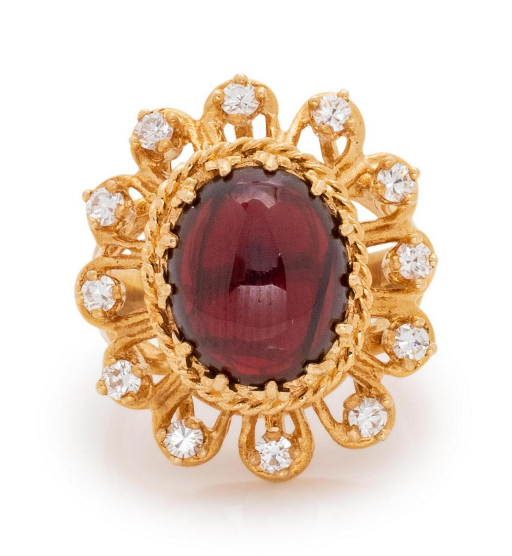 A 14 Karat Yellow Gold, Garnet and Diamond Ring,: A 14 Karat Yellow Gold, Garnet and Diamond Ring, containing one oval shape cabochon cut garnet measuring approximately 11.60 x 9.90 x 5.15 mm and 12 round brilliant cut diamonds weighing approximately