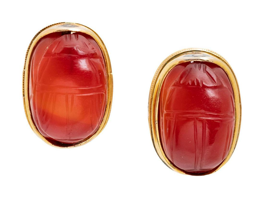 A Pair of Yellow Gold and Carnelian Scarab Earrings,: A Pair of Yellow Gold and Carnelian Scarab Earrings, containing two carved carnelian scarabs measuring approximately 15.80 x 10.70 mm. 6.50 dwts. Provenance: