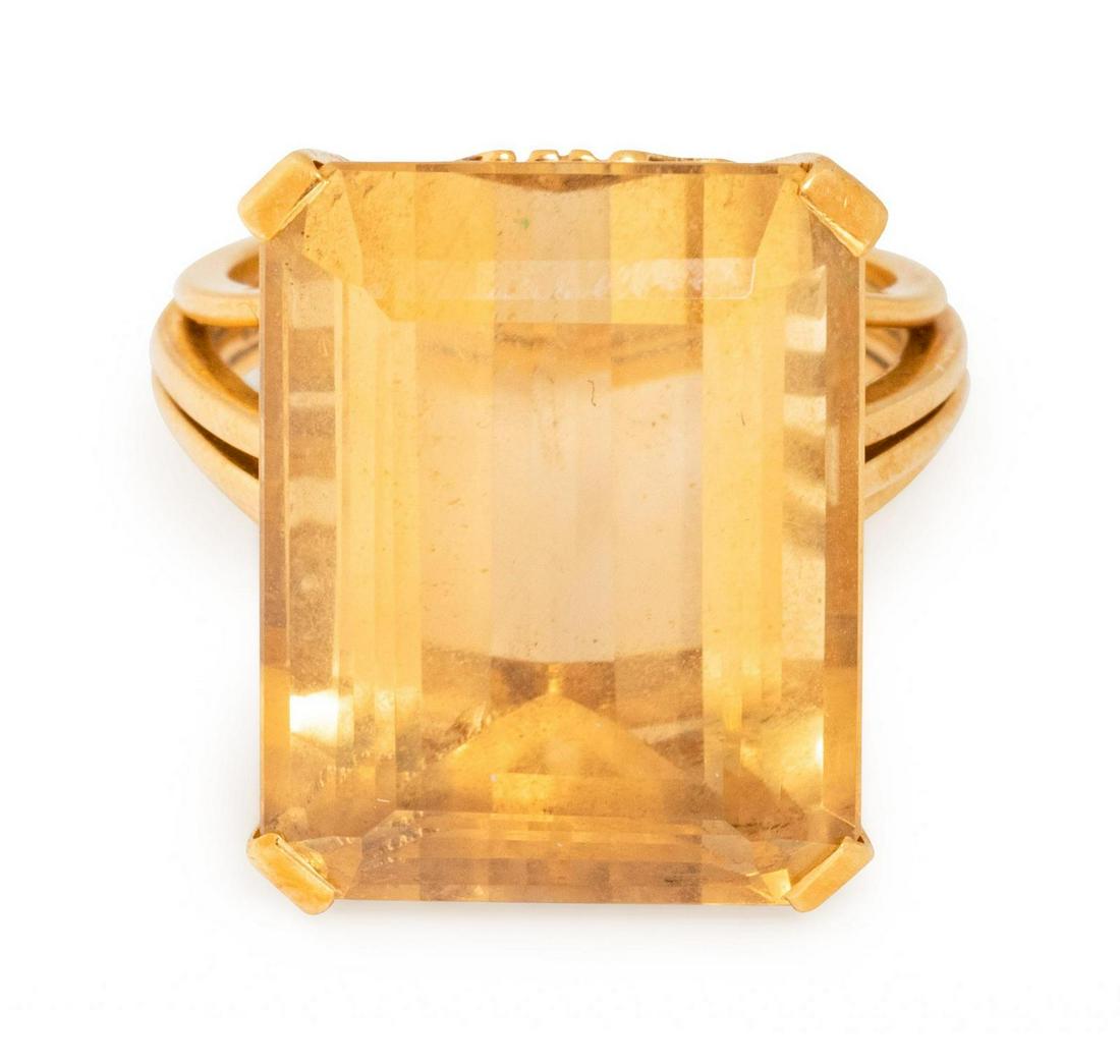 A Retro 18 Karat Yellow Gold and Citrine Ring, : A Retro 18 Karat Yellow Gold and Citrine Ring, containing one octagonal step cut citrine measuring approximately 18.20 x 14.20 x 9.85 mm. Stamp: (maker's mark) 750. 6.40 dwts. Provenance: Property o