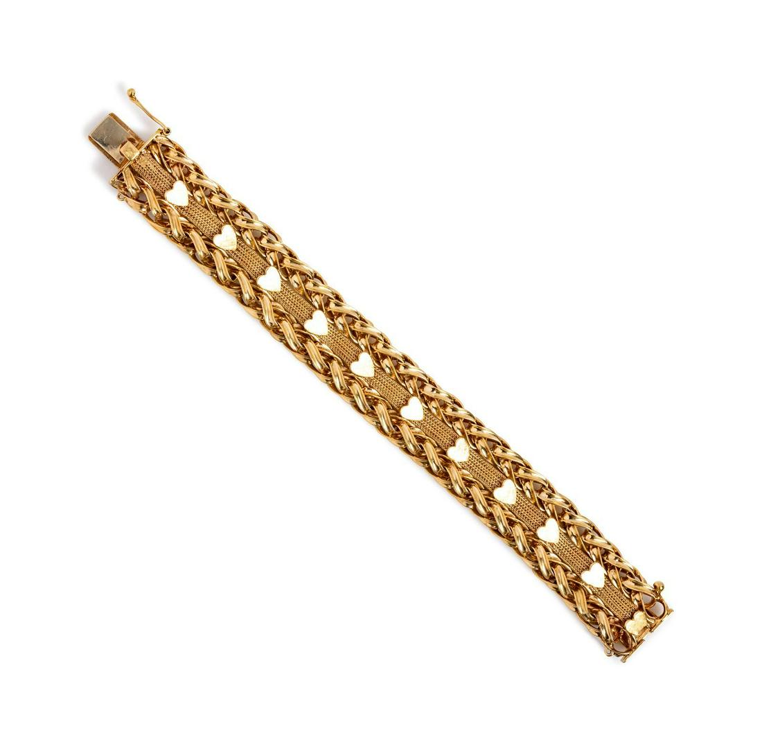 A 14 Karat Yellow Gold Bracelet,: A 14 Karat Yellow Gold Bracelet, consisting of wheat chain and fancy link chain with heart motifs, measuring approximately 19.30 mm wide. Stamp: 14K. 38.30 dwts. Provenance: