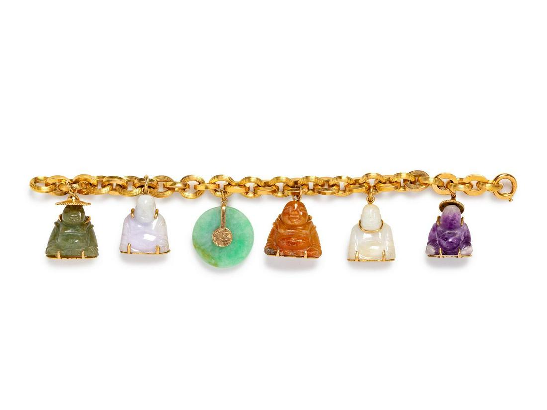 A Yellow Gold and Jade Charm Bracelet,: A Yellow Gold and Jade Charm Bracelet, consisting of a cable link chain bracelet suspending five carved jade buddha charms and a jade bi charm. Bracelet stamp: 750 (obscured). Four charms stamp: 14K. 