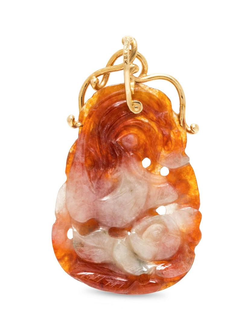 A 14 Karat Yellow Gold and Jadeite Pendant,: A 14 Karat Yellow Gold and Jadeite Pendant, containing one carved and pierced jadeite measuring approximately 46.00 x 32.00 mm.Stamp: BARTON 14K.9.10 dwts. Provenance: Property from the Estate of Jacq