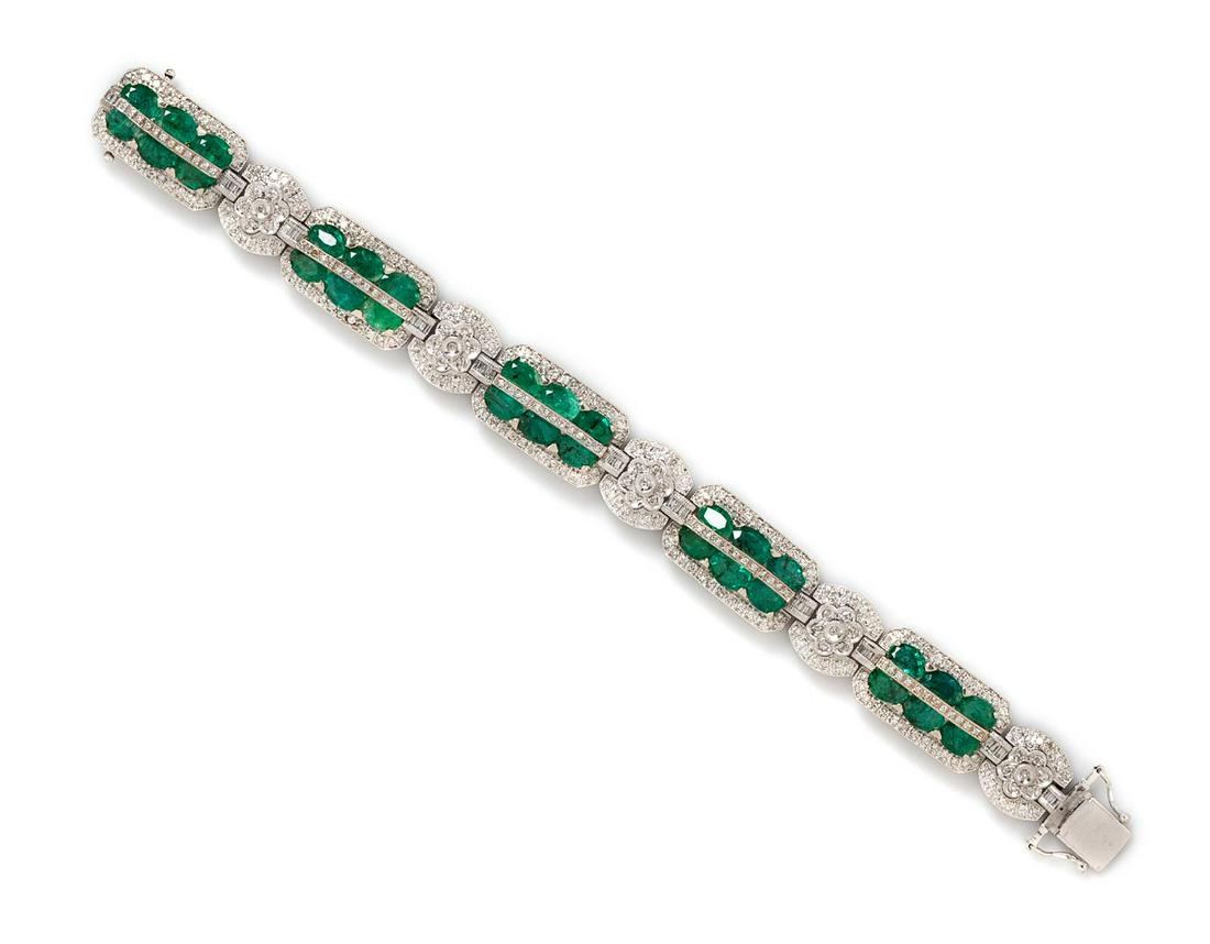 A 14 Karat White Gold, Emerald and Diamond Bracelet,: A 14 Karat White Gold, Emerald and Diamond Bracelet, containing 30 oval shape mixed cut emeralds measuring approximately 6.60 x 3.90 mm and 344 round brilliant and baguette cut diamonds weighing appro
