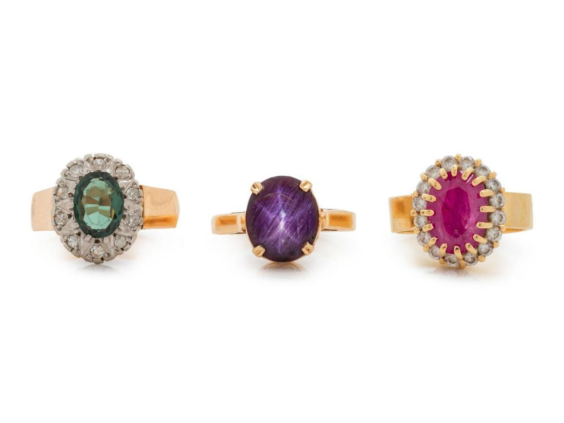 A Collection of Yellow Gold and Gemstone Rings,: A Collection of Yellow Gold and Gemstone Rings, consisting of a bicolor gold ring containing one oval shape mixed cut synthetic spinel and 10 single cut diamonds, a ring containing one oval shape cabo