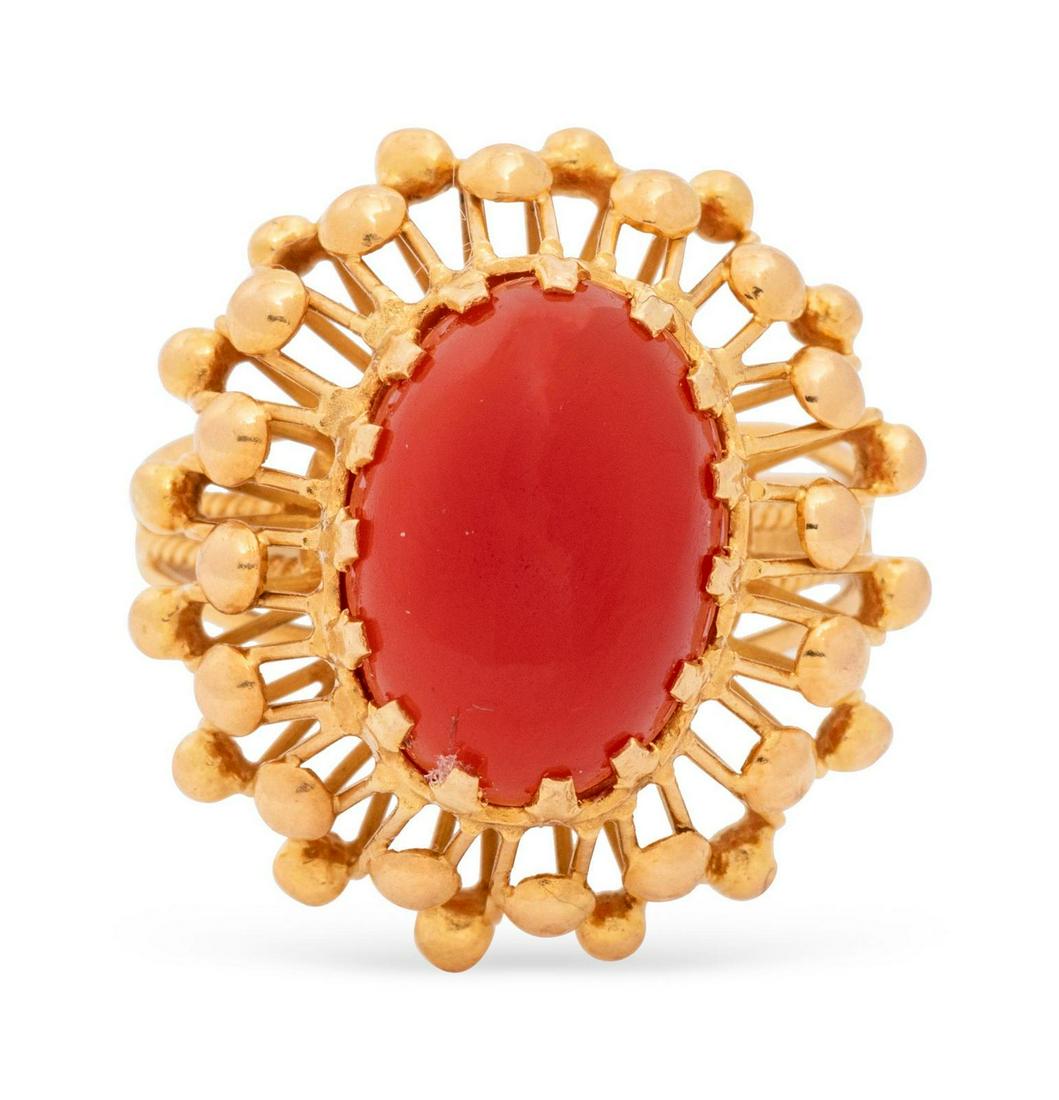 A Yellow Gold and Carnelian Ring,: A Yellow Gold and Carnelian Ring, containing one oval shape cabochon cut carnelian measuring approximately 14.00 x 10.00 mm. 4.50 dwts. Provenance: