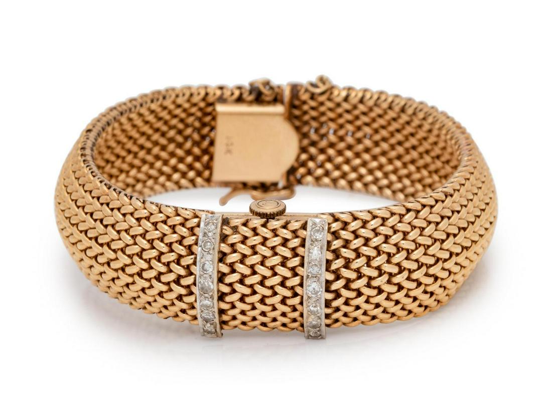 A 14 Karat Yellow Gold and Diamond Surprise Wristwatch,: A 14 Karat Yellow Gold and Diamond Surprise Wristwatch, Kent, the hinged cover containing 14 single cut diamonds weighing approximately 0.10 carat total, off white dial signed KENT, baton and Arabic n