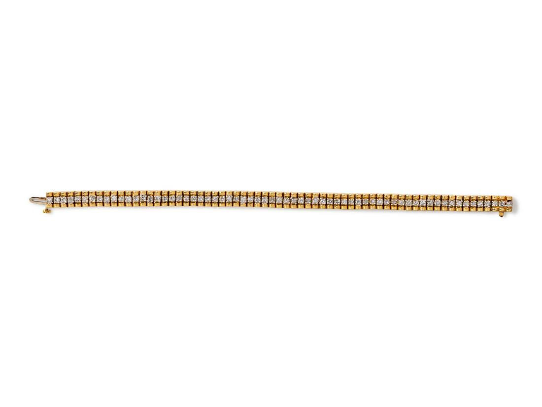 A Yellow Gold and Diamond Bracelet,: A Yellow Gold and Diamond Bracelet, containing 65 round brilliant cut diamonds weighing approximately 3.00 carats total. Stamp: 3CTW. 19.30 dwts. Provenance: