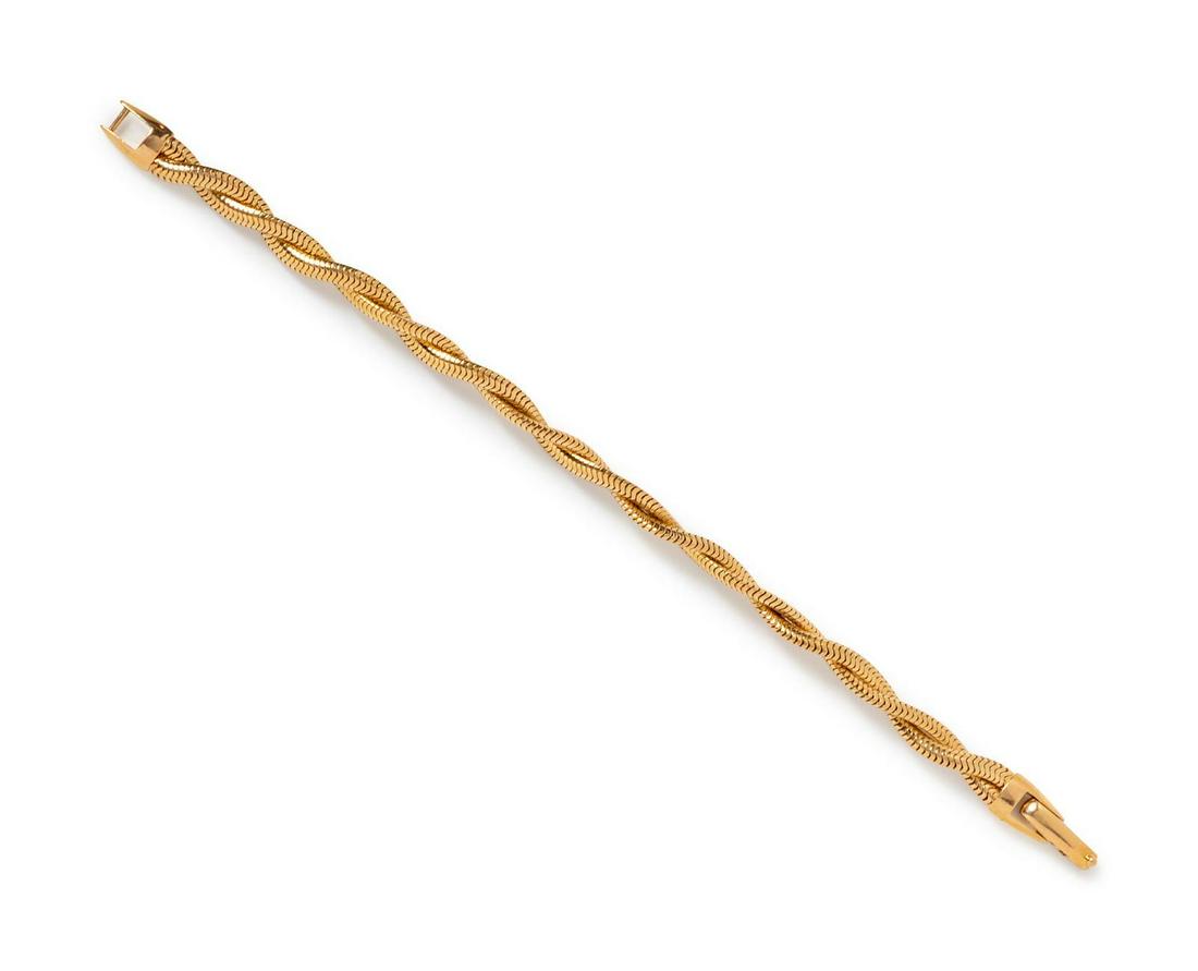 A 14 Karat Yellow Gold Bracelet,: A 14 Karat Yellow Gold Bracelet, consisting of two twisted snake chains. Stamp: FORSTNER 14K. 10.40 dwts. Provenance: