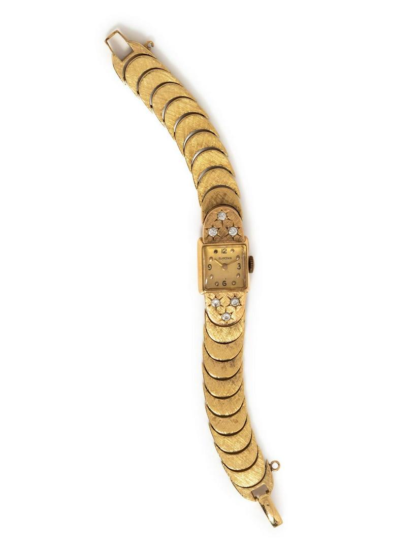 A 14 Karat Yellow Gold and Diamond Wristwatch,: A 14 Karat Yellow Gold and Diamond Wristwatch, Blancpain, the lugs containing six round brilliant cut diamonds weighing approximately 0.30 carat total, 18.00 x 13.00 mm case dimensions, brushed gold d