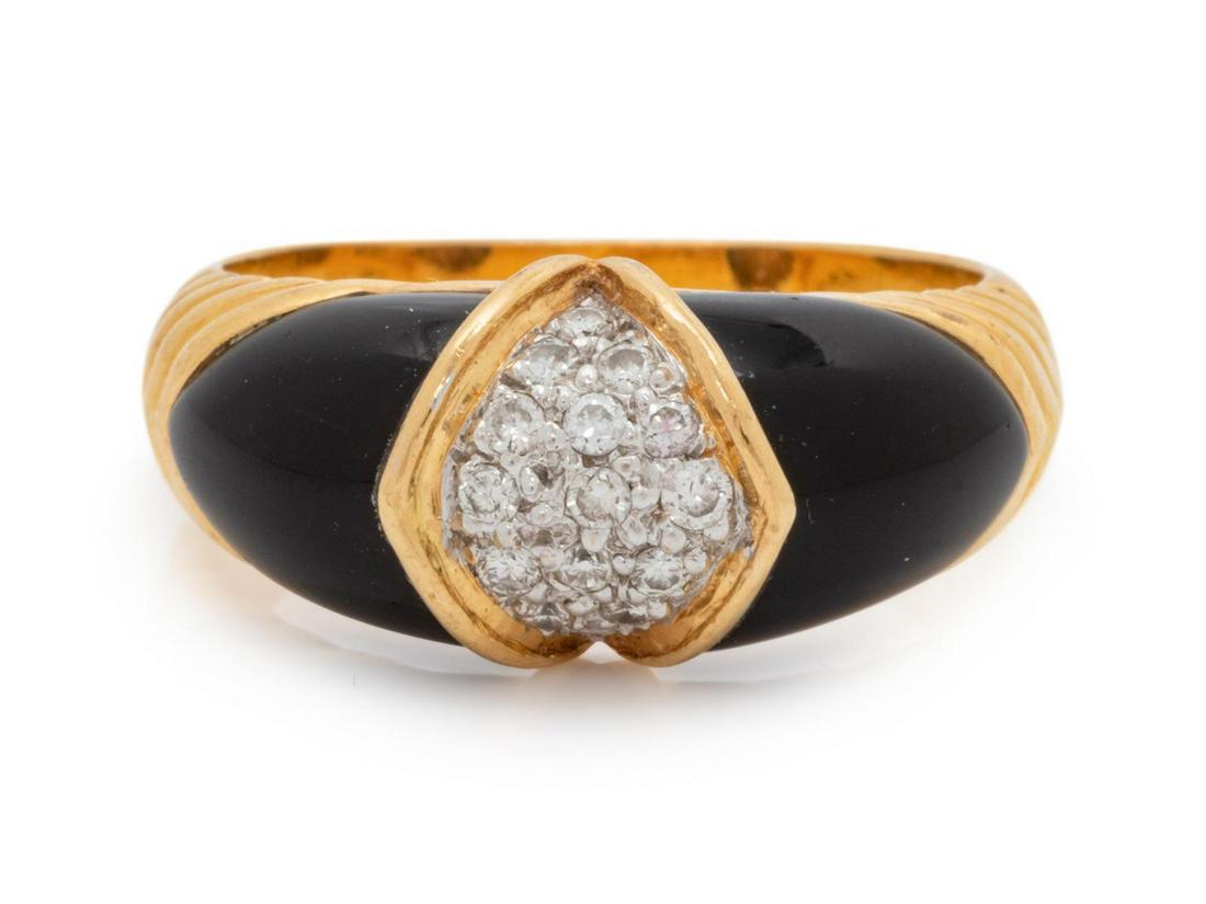 An 18 Karat Yellow Gold, Diamond and Enamel Ring,: An 18 Karat Yellow Gold, Diamond and Enamel Ring, containing 15 round brilliant cut diamonds weighing approximately 0.10 carat total, with black enamel detail. Stamp: 750 18K AJF. 3.90 dwts. Provenanc