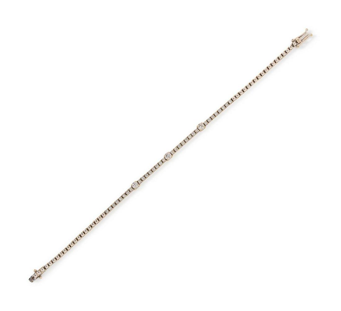 An 18 Karat White Gold and Diamond Bracelet,: An 18 Karat White Gold and Diamond Bracelet, containing 35 round brilliant cut diamonds weighing approximately 1.30 carats total. Stamp: 750. 5.50 dwts. Provenance:
