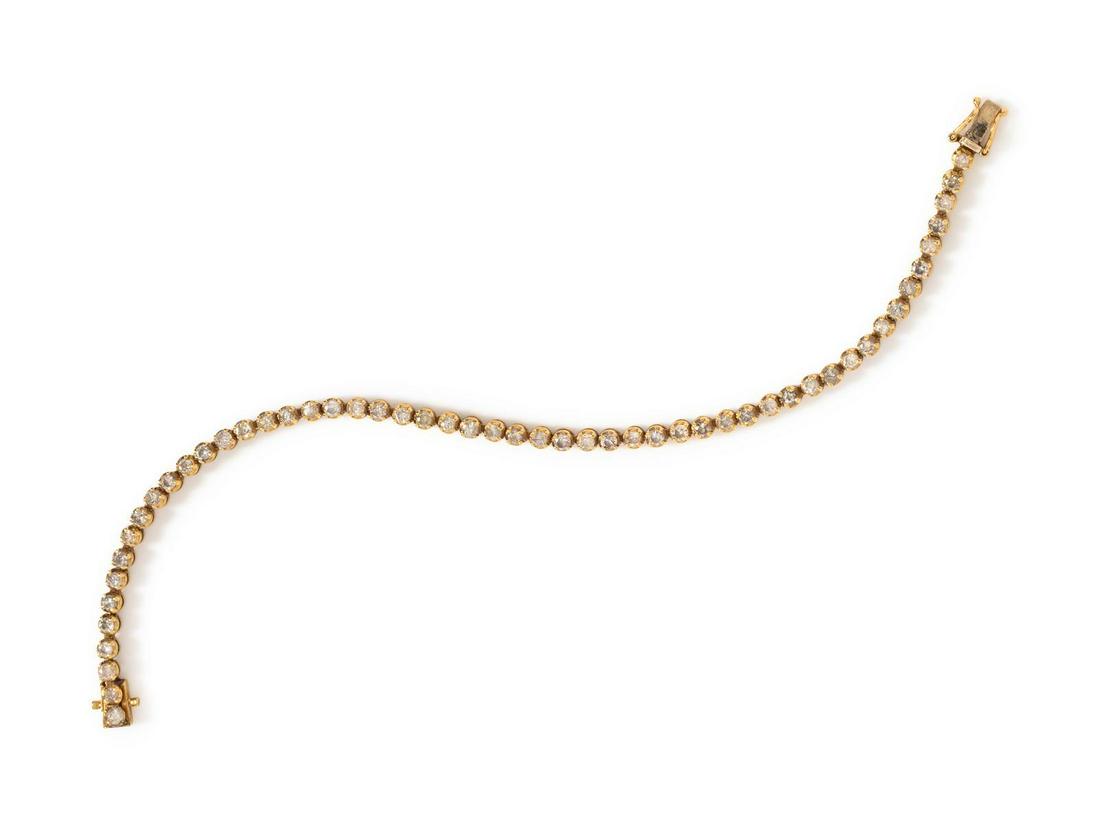A 14 Karat Yellow Gold and Diamond Bracelet,: A 14 Karat Yellow Gold and Diamond Bracelet, containing 53 round brilliant cut diamonds weighing approximately 2.00 carats total. Stamp: 14K. 5.50 dwts. Provenance: