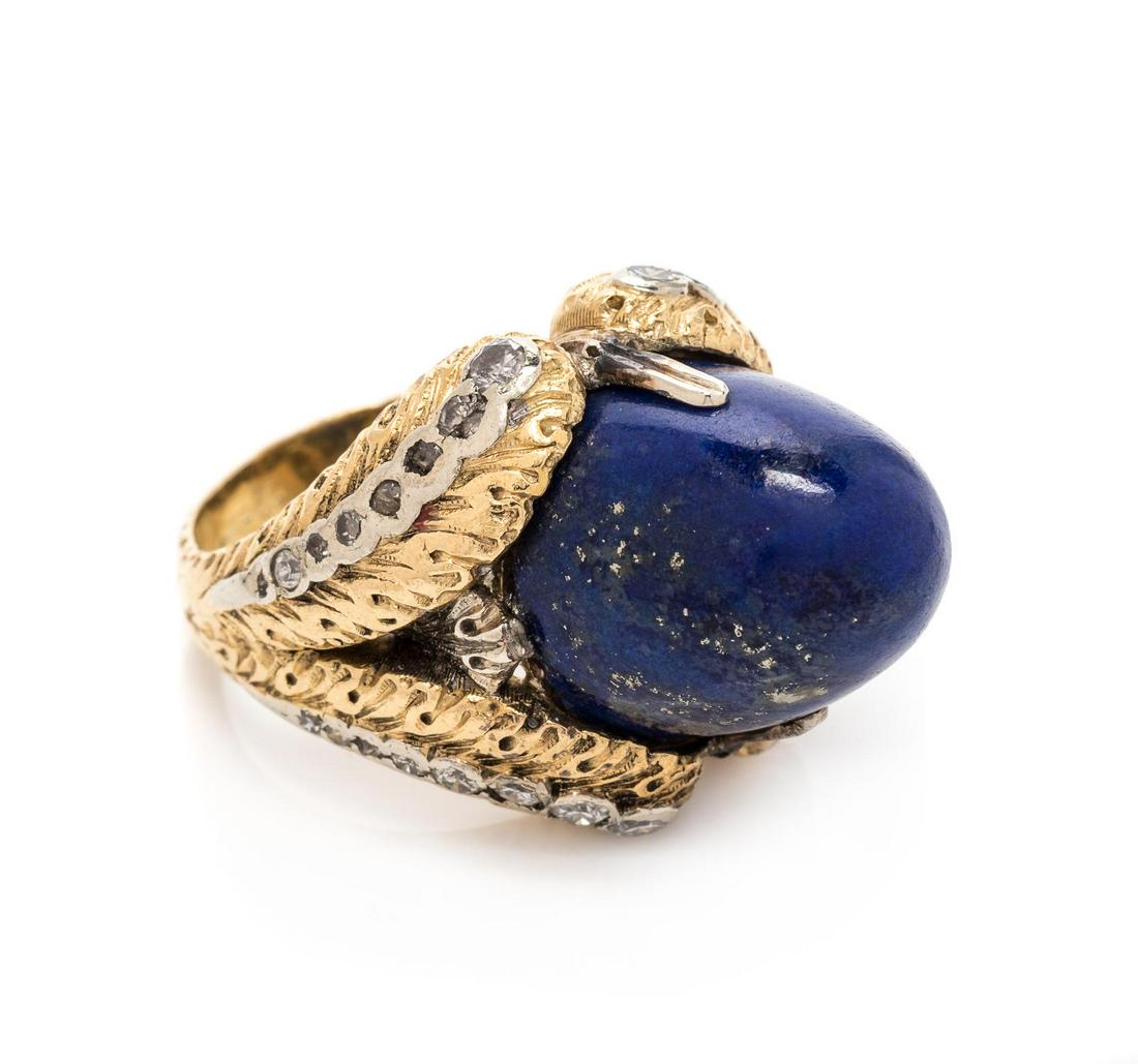 An 18 Karat Yellow Gold, Diamond and Lapis Lazuli Ring,: An 18 Karat Yellow Gold, Diamond and Lapis Lazuli Ring, Buccellati, containing one cabochon cut lapis lazuli measuring approximately 13.65 x 13.10 mm and 28 single cut diamonds weighing approximately 