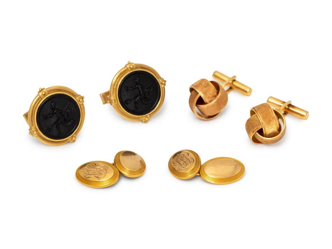 A Collection of Yellow Gold Cufflinks,: A Collection of Yellow Gold Cufflinks, consisting of a pair of 18 karat gold knot motif cufflinks, a pair of 18 karat and black hardstone intaglio cufflinks with 14 karat gold backings and a pair of 1