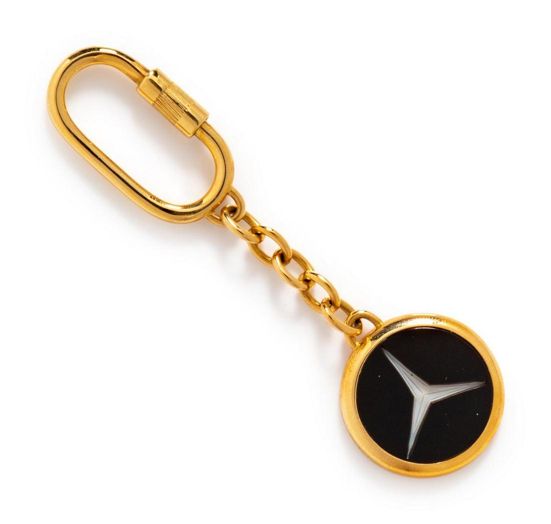 An 18 Karat Yellow Gold and Sardonyx Intaglio Key: An 18 Karat Yellow Gold and Sardonyx Intaglio Key Chain, Fred Paris, containing one round sardonyx plaque measuring approximately 20.00 mm in diameter. Stamp: 18K W. GERMANY FRED PARIS. 12.80 dwts. Ac