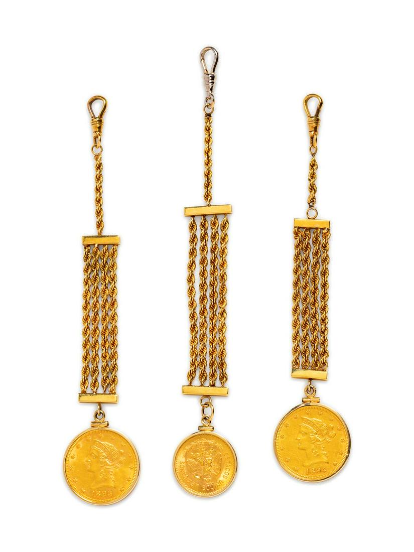A Collection of Yellow Gold and Gold Coin Vest Fobs,: A Collection of Yellow Gold and Gold Coin Vest Fobs, consisting of two 18 karat yellow gold rope chain fob pendants, each containing a US $10 Liberty Head gold coin, dated 1893 and 1894, together with
