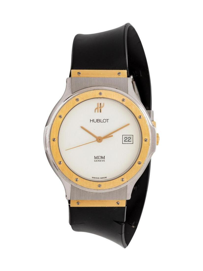 A Steel and Yellow Gold Wristwatch, Hublot,: A Steel and Yellow Gold Wristwatch, Hublot, 33.00 mm case diameter, white dial signed HUBLOT, with yellow gold bezel affixed with 12 screws, case back affixed with six screws, quartz movement, rubber 