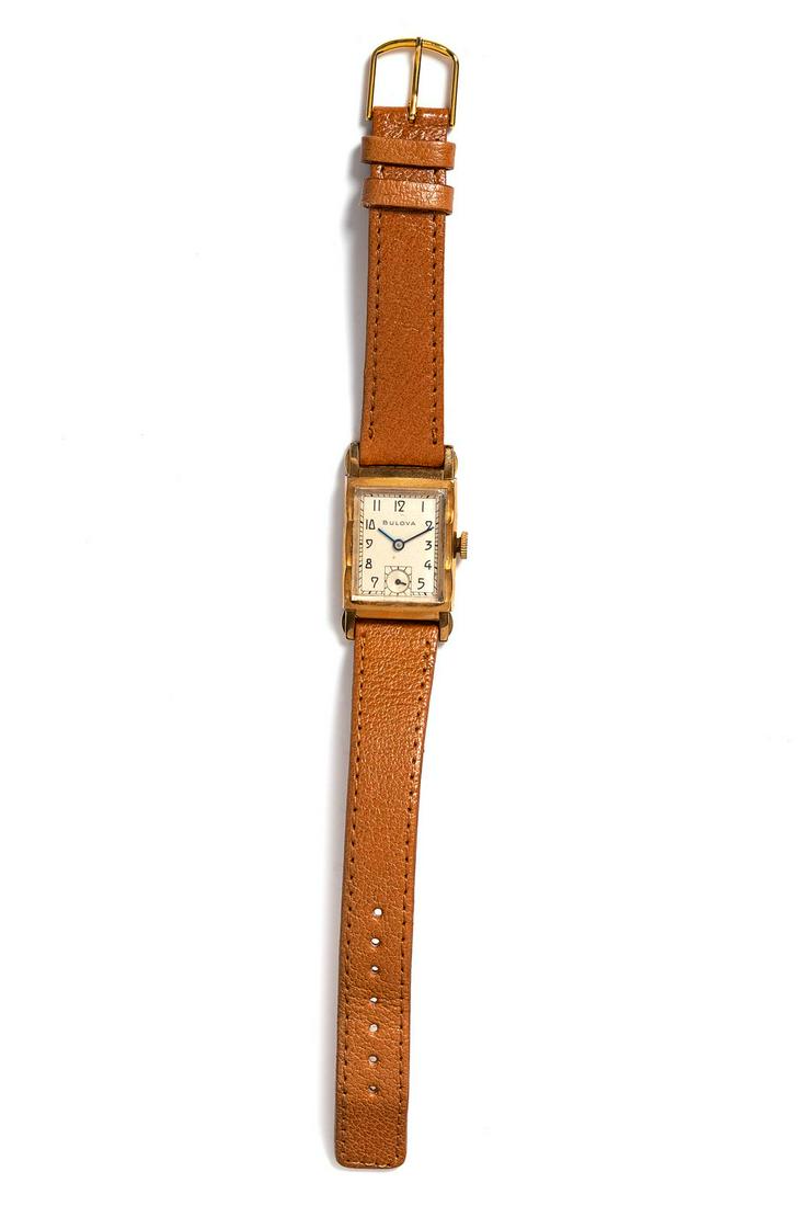 A Gold Filled Wristwatch, Bulova,: A Gold Filled Wristwatch, Bulova, 28.00 x 21.00 mm case dimensions, off white dial signed BULOVA, black Arabic numerals, blued steel pencil hands, subdial for seconds at 6 o'clock, 21 jewel movement s