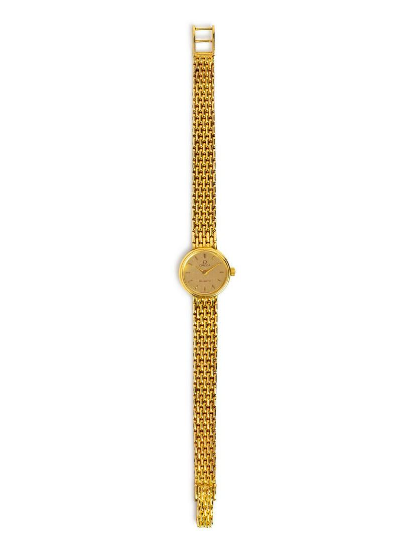 A 14 Karat Yellow Gold Wristwatch, Omega,: A 14 Karat Yellow Gold Wristwatch, Omega, 18.00 mm case diameter, matte gold dial signed OMEGA, snap on case back, quartz movement, mesh link bracelet, fold over clasp. Case back stamp: 585 (Swiss hal