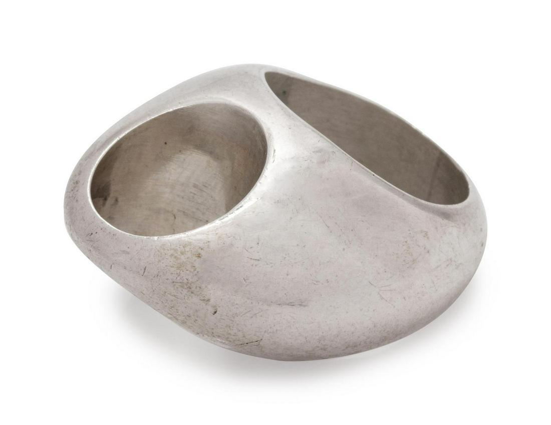 A Modernist Sterling Silver Ring, Arne Johansen,: A Modernist Sterling Silver Ring, Arne Johansen, consisting of a domed ring with round negative space. Stamp: AJ 925 2 DENMARK. 10.90 dwts. Provenance: