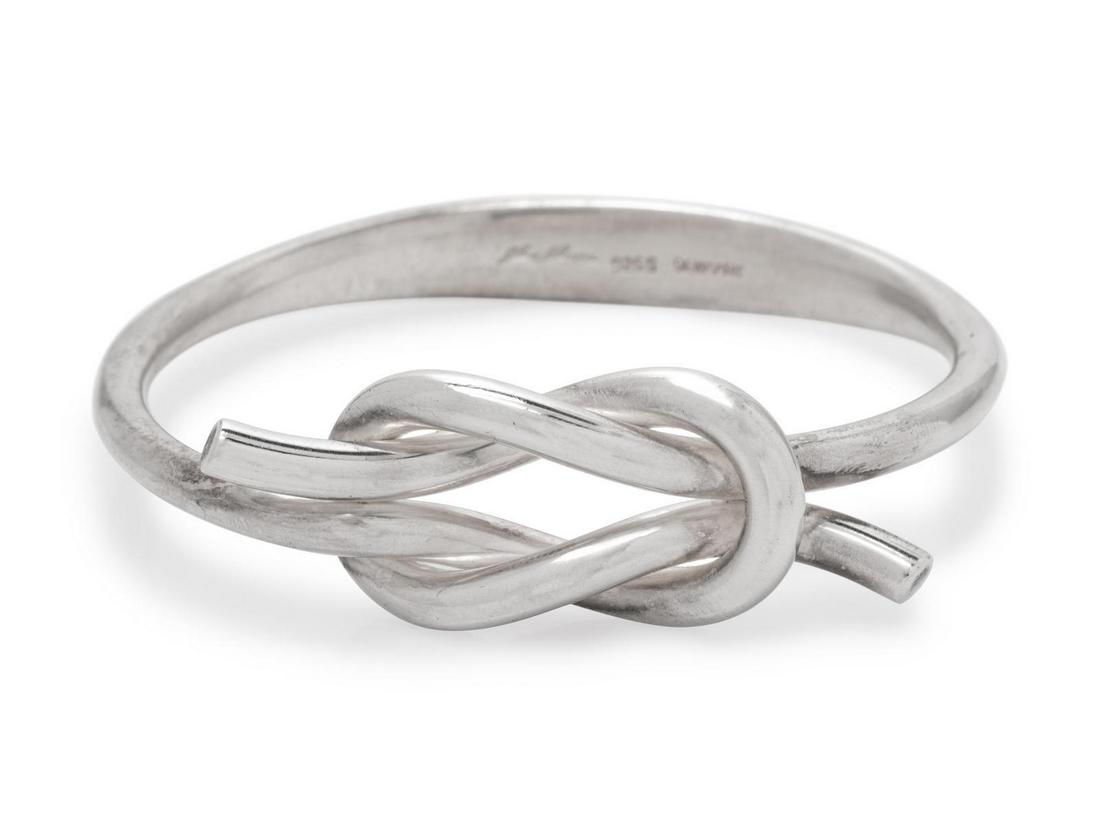 A Sterling Silver Bangle Bracelet, Hans Hansen,: A Sterling Silver Bangle Bracelet, Hans Hansen, with interlocking Hercules knot motif. Stamp: (maker's mark) 925 S DENMARK. 52.90 dwts. Provenance: