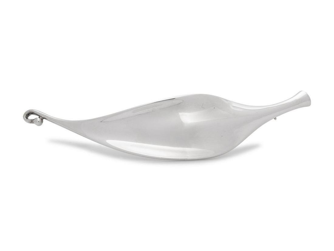 A Modernist Sterling Silver Brooch, Vivianna Torun: A Modernist Sterling Silver Brooch, Vivianna Torun Bulow-Hube for Georg Jensen, designed as a stylized leaf. Stamp: (maker's mark) 925 S DENMARK 391 TORUN. 18.10 dwts. Provenance: