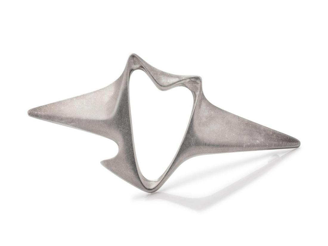 A Modernist Sterling Silver Brooch, Henning Koppel for: A Modernist Sterling Silver Brooch, Henning Koppel for Georg Jensen, designed as an open abstract bird. Stamp: 925 S DENMARK (maker's mark) 340. 9.40 dwts. Provenance: