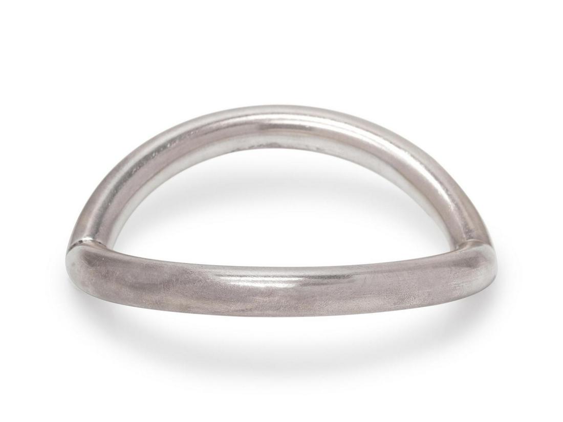A Modernist Sterling Silver Bangle Bracelet, Nanna: A Modernist Sterling Silver Bangle Bracelet, Nanna Ditzel for Georg Jensen, in a curved design. Stamp: 925 S (maker's mark) DENMARK 372. 43.80 dwts. Provenance: